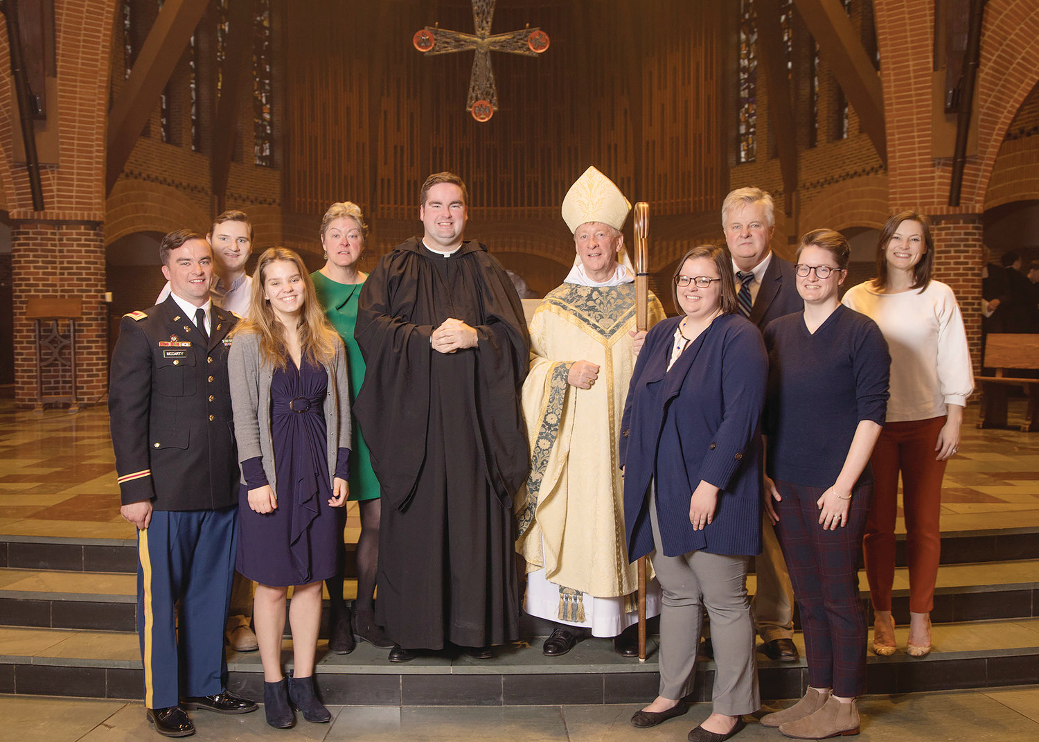 PROFESSION OF SOLEMN VOWS: Abbot Mark Cooper, O.S.B., gathers with Brother Francis Ryan McCarty, O.S.B., and his parents and siblings following Brother Francis’ profession of solemn vows on Feb. 2 at Saint Anselm Abbey.